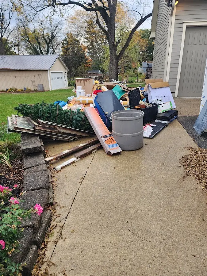 Dumpster being loaded with debris for 3 Yard Dumpster Rental in North Augusta